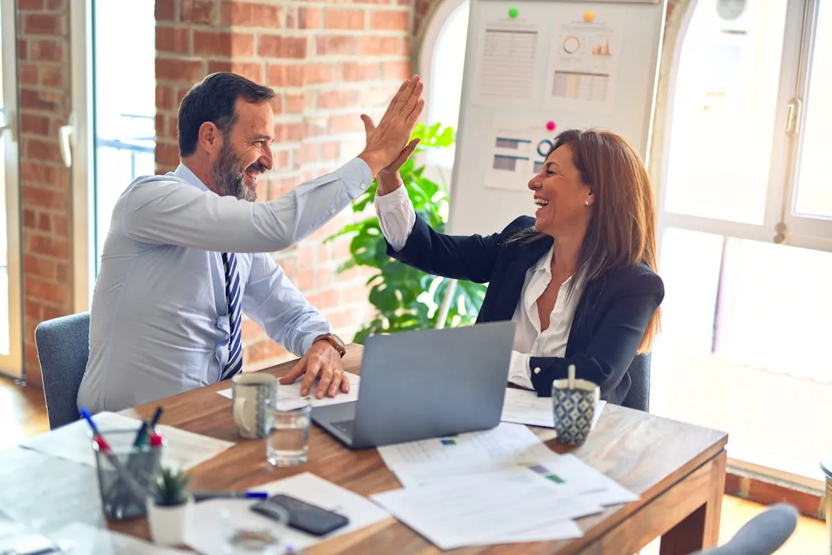 Agency team collaborating during a client chatbot onboarding and launch